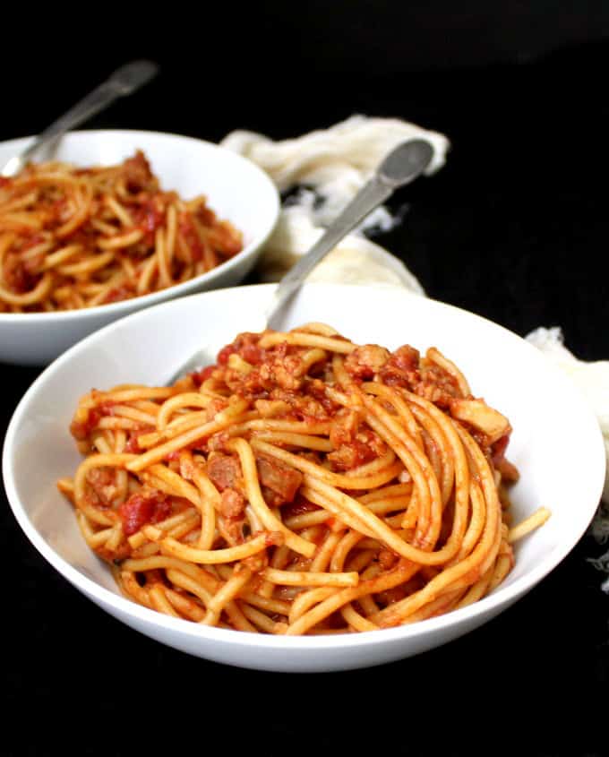 Two white bowls with Instant Pot Spaghetti with Marinara,