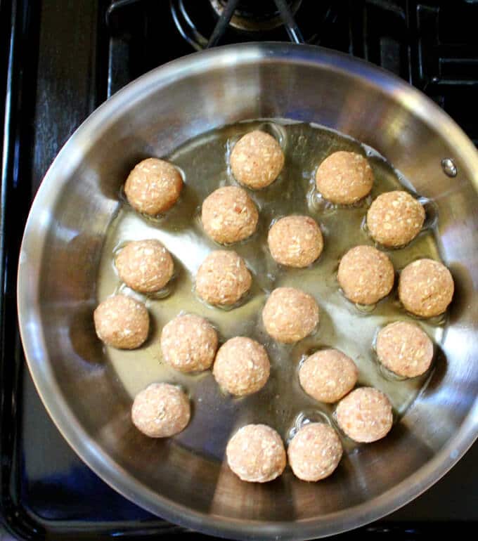 Vegan Barbecue Meatballs frying in oil.