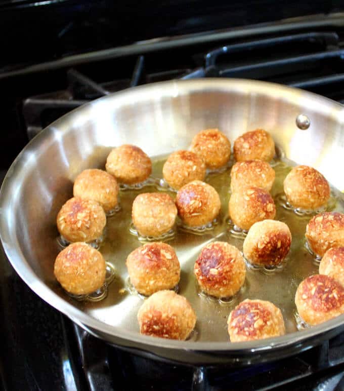 Vegan Barbecue Meatballs frying in skillet.