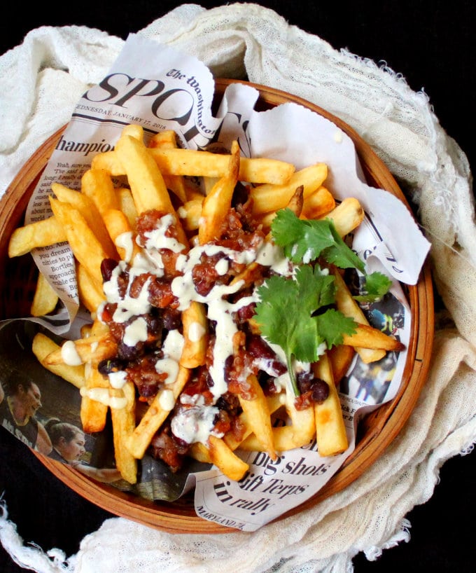 Top shot of Vegan Chili Fries smothered in a bean and quinoa chili with a horseradish sauce - HolyCowVegan.net