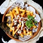 Vegan Chili Fries drizzled with a creamy, cheezy horseradish sauce - HolyCowVegan.net