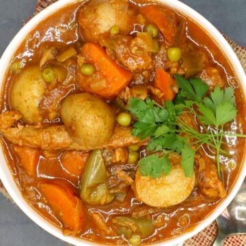 Photo of vegan Instant Pot beef stew with parsley garnish.