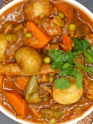 Photo of vegan Instant Pot beef stew with parsley garnish.