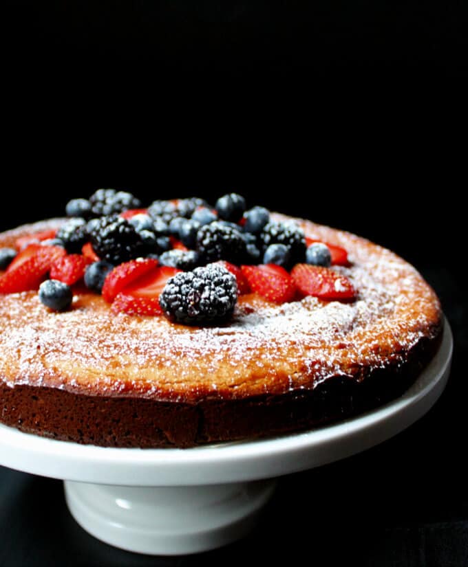 Gluten-Free Vegan Berry Almond Flour Cake  on cake stand.