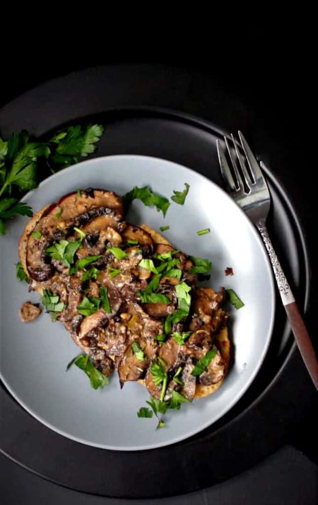 Mushrooms on Toast on plate with fork.