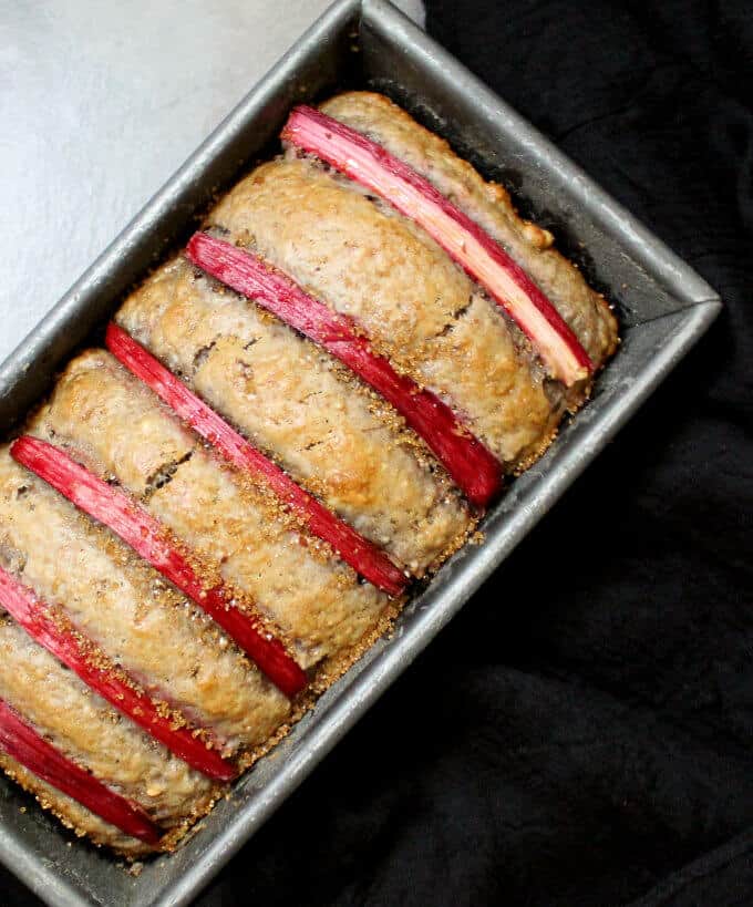Overhead photo of vegan rhubarb bread in a loaf pan.
