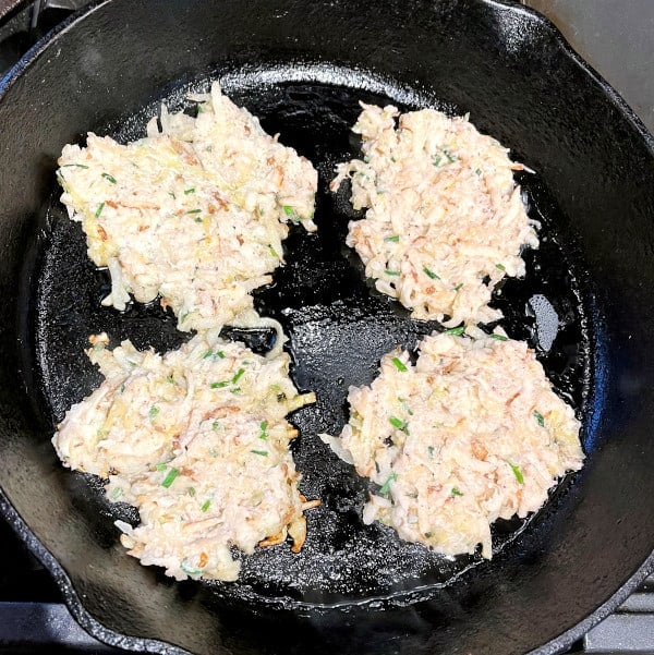 Vegan potato sauerkraut pancakes in cast iron pan