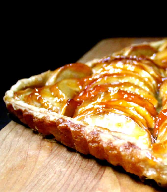 Vegan French apple tart on wooden board.
