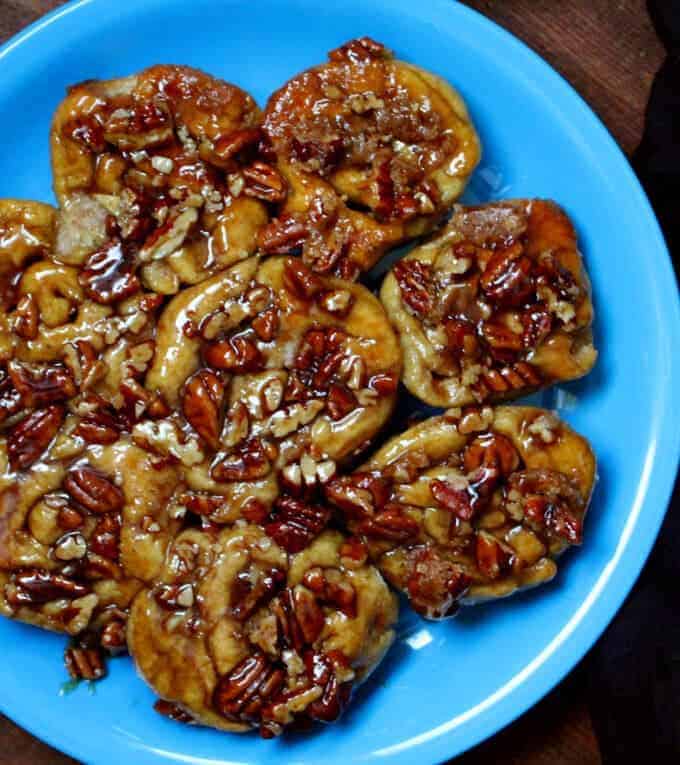 These vegan Sourdough Sticky Buns make a delicious breakfast or dessert, and bonus, you can make it with your discard or unfed starter. They are gooey, sticky, crusted with caramel-coated pecans, and absolutely scrumptious. A soy-free recipe. #vegan #soyfree #breakfast HolyCowVegan.net