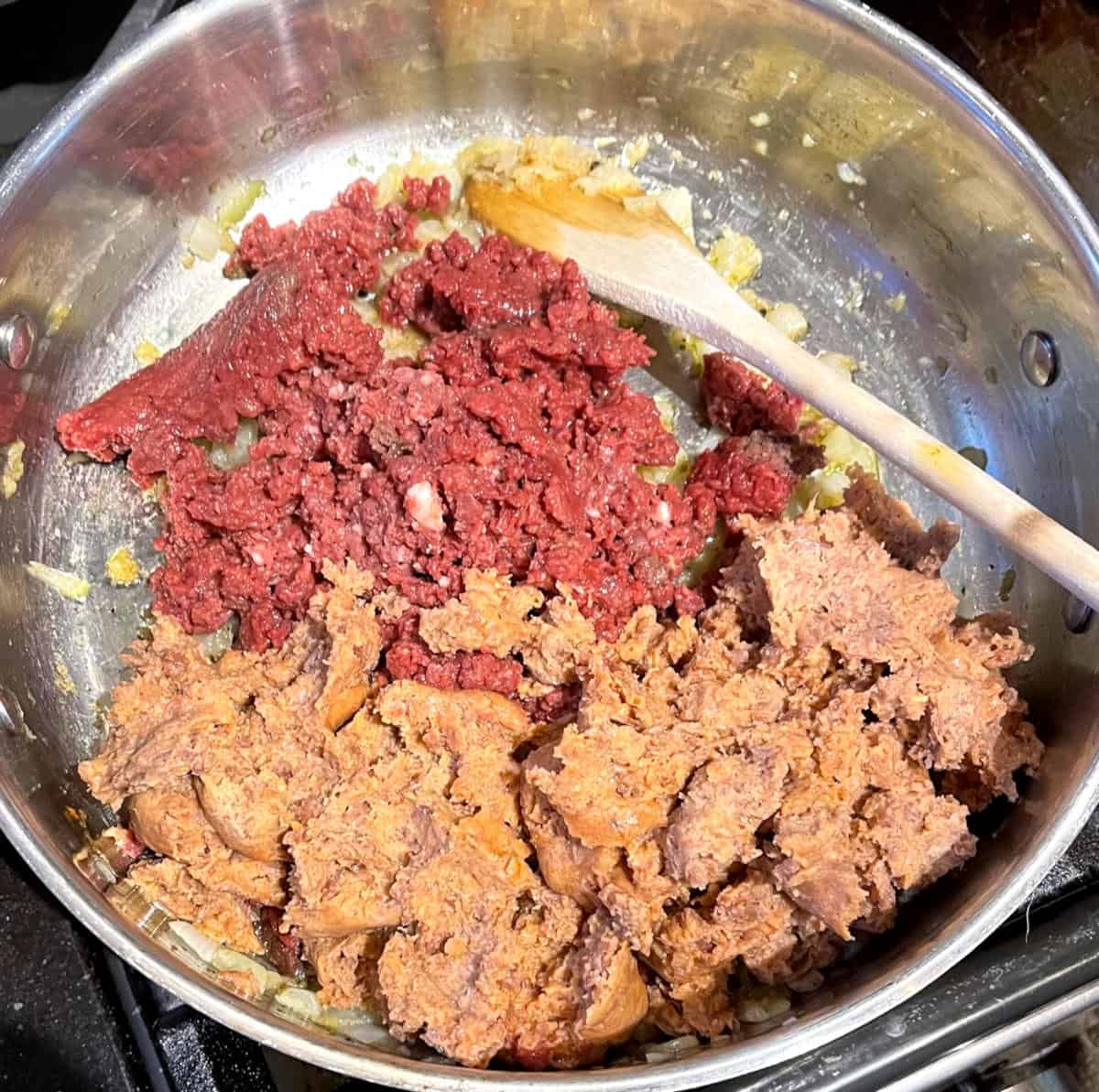 Vegan meats added to saute pan.