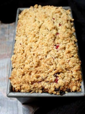A vegan Cranberry Breakfast Bread is the perfect way to start a holiday with family and friends. The tender crumb has tiny bursts of tart, juicy cranberries and nutty pecans. A vegan, soy-free and nut-free recipe.#vegan #soyfree #nutfree #thanksgiving #recipe HolyCowVegan.net