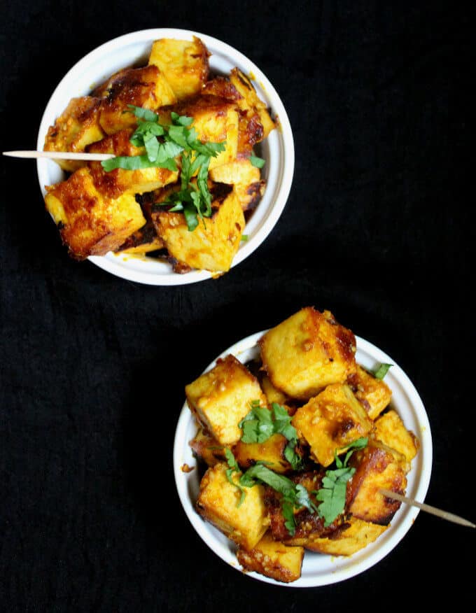 My Easy Mango Chipotle Glazed Tofu, with sparkling sweet, spicy, tangy and salty notes, makes a tasty and simple finger food for a full-blown event or a party of one. This recipe has only seven ingredients, and it takes under 20 minutes to put together. A vegan, nut-free and gluten-free recipe. #vegan #appetizer #fingerfood #mango #tofu #recipe #glutenfree #nutfree HolyCowVegan.net