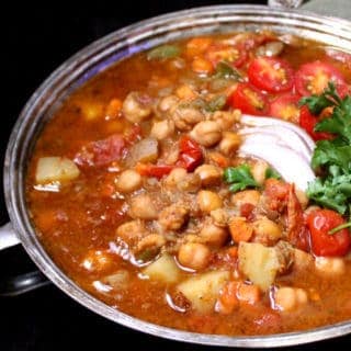 This Instant Pot Moroccan Chickpea Stew has no added oil and is filled only with stuff that's super healthy. Great if you're looking for a weight loss recipe packed with flavor in the New Year. #vegan #glutenfree #soyfree #nutfree #healthy #weightloss #recipe HolyCowVegan.net