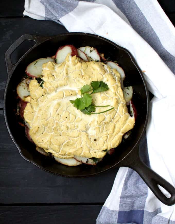 Vegan Spiced Potatoes with "Eggs" is a delicious spin on a traditional breakfast served by the Parsi community in India. The ingredient list is spectacularly simple, and the flavor returns are enormous. Perfect for breakfast, lunch, brunch or dinner. #vegan #glutenfree #nutfree #breakfast #recipe #eggless HolyCowVegan.net