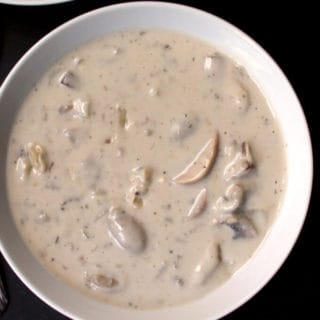 This extra creamy and tasty Vegan Cream of Mushroom Soup hugs you with warmth and deliciousness. It's the perfect comfort food, and it's dairy-free. #vegan #dairyfree #mushroom #soup HolyCowVegan.net