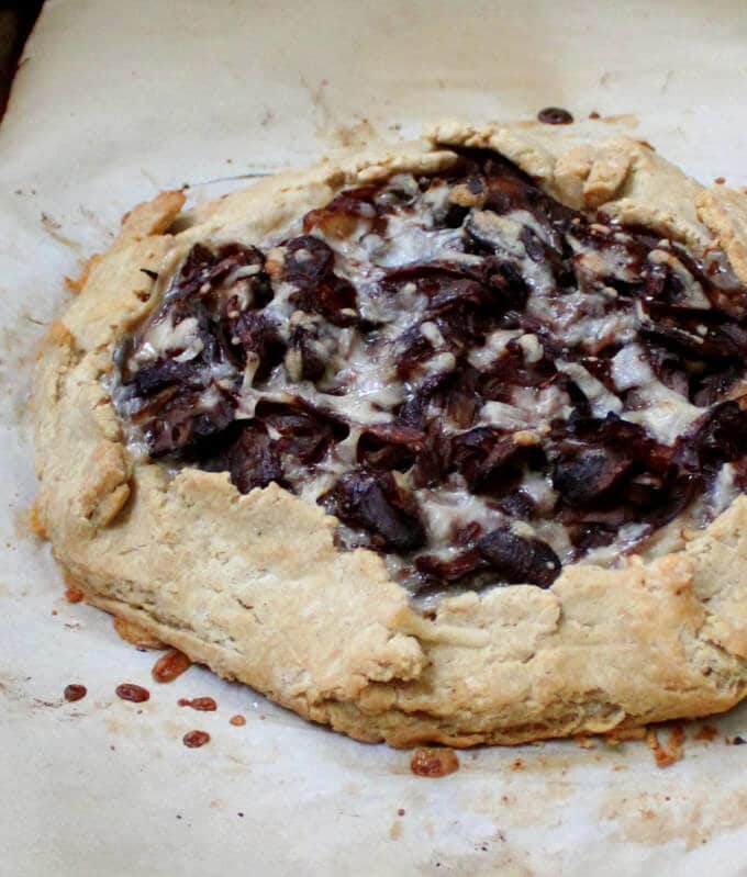 Savory Gluten-free and vegan Caramelized Onion and Mushroom Galette with a flaky, golden, gluten-free and vegan crust that'll blow your mind. #vegan, #glutenfree, #soyfree, #nutfree, #dinner HolyCowVegan.net