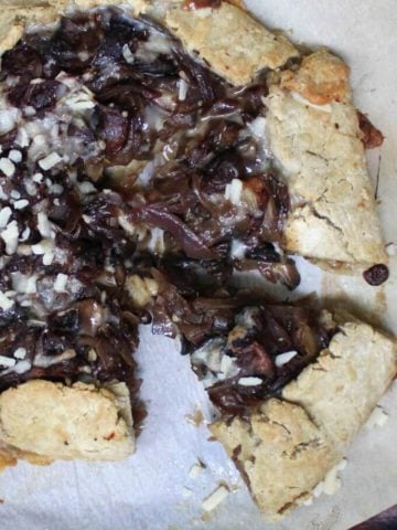 Savory Gluten-free and vegan Caramelized Onion and Mushroom Galette with a flaky, golden, gluten-free and vegan crust that'll blow your mind. #vegan, #glutenfree, #soyfree, #nutfree, #dinner HolyCowVegan.net