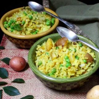 Flattened Rice with Potatoes, Onions and Peas, or Kande Pohe, are a classic Indian breakfast. They are healthy, delicious, gluten-free, soy-free, nut-free and divinely vegan. #vegan #soyfree #nutfree #glutenfree #breakfast #indian #recipe HolyCowVegan.net