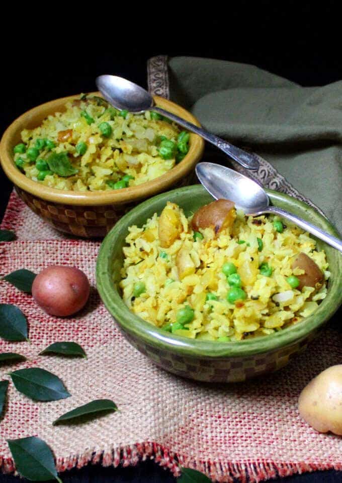 Flattened Rice with Potatoes, Onions and Peas, or Kande Pohe, are a classic Indian breakfast. They are healthy, delicious, gluten-free, soy-free, nut-free and divinely vegan. #vegan #soyfree #nutfree #glutenfree #breakfast #indian #recipe HolyCowVegan.net