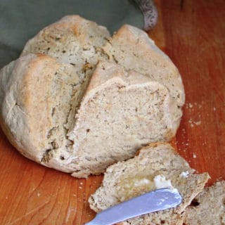 This vegan gluten-free Irish Soda Bread is as classic and traditional as this bread can get, only with a modern, healthy twist. The bread has a dense texture, a soft and tender crumb, and there's nothing quite as delicious as a warm, hot-off-the-oven slice slathered with vegan butter. #stpatricksday #irishrecipe #vegan #bread #irish #breakfast #glutenfree HolyCowVegan.net