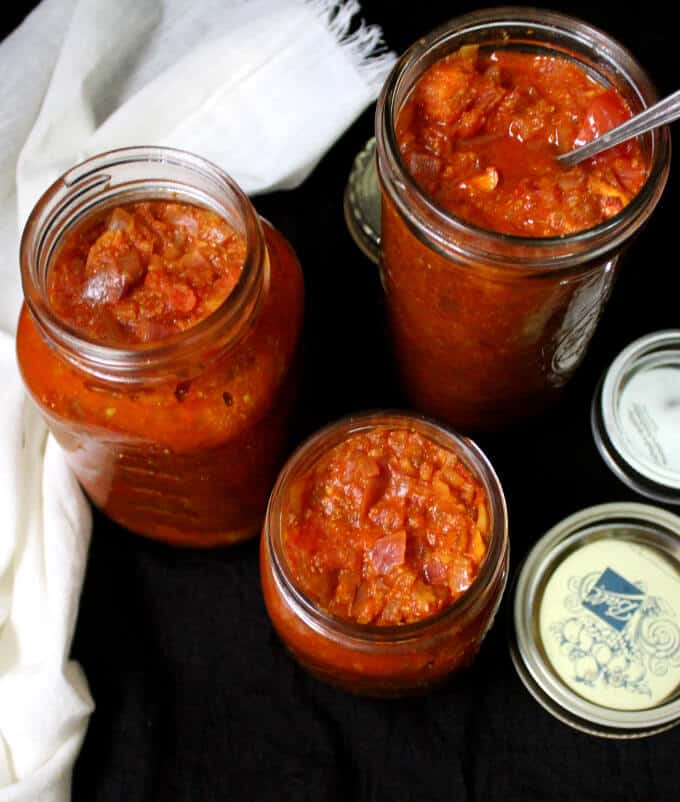 Basic Tomato Onion Sauce in three glass mason jars.