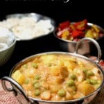 A creamy vegan peas potato curry that comes together in minutes. #vegan, #curry, #potatoes, #indian HolyCowVegan.net