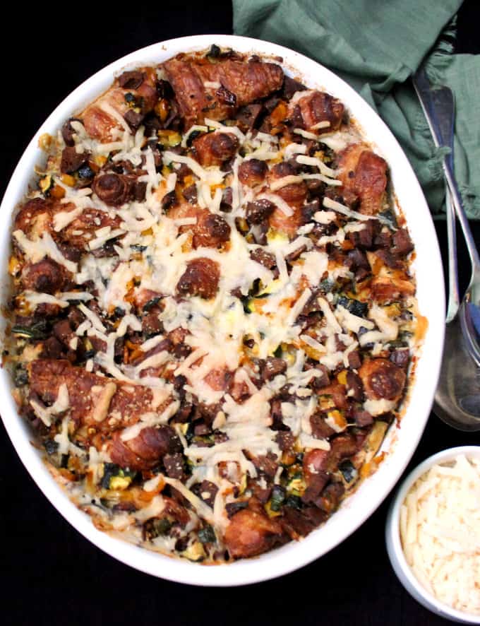 A Vegan Cheesy Croissant Casserole is the perfect dish for breakfast or brunch. It is golden, bubbling, cheesy and creamy, and scattered with delicious bits of croissants and vegan sausage. #vegan, #casserole, #mothersday, #croissant HolyCowVegan.net