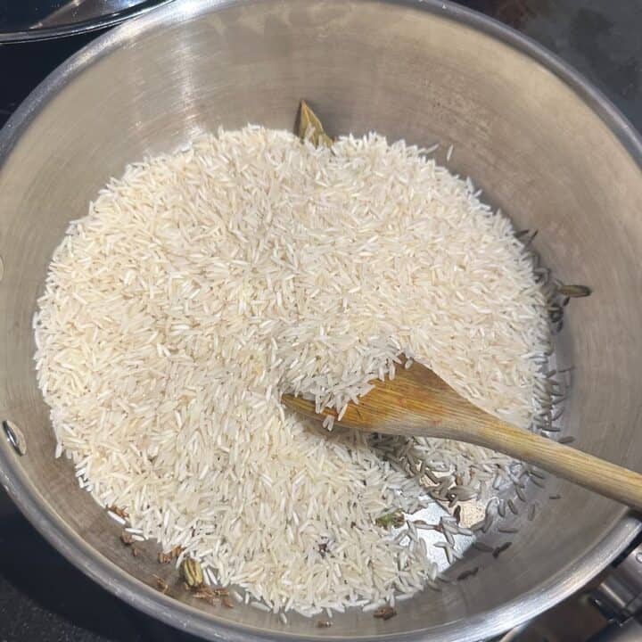 Rice added to pan with spices.