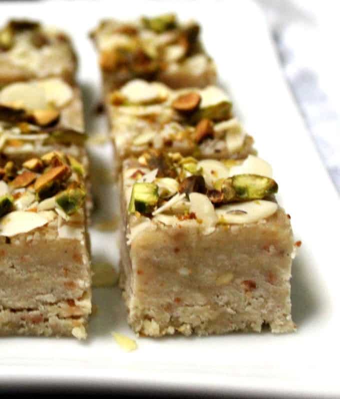 A close up shot of an Indian vegan barfi on a white plate