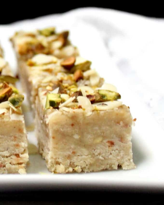 Vegan Barfi with nuts on a white plate