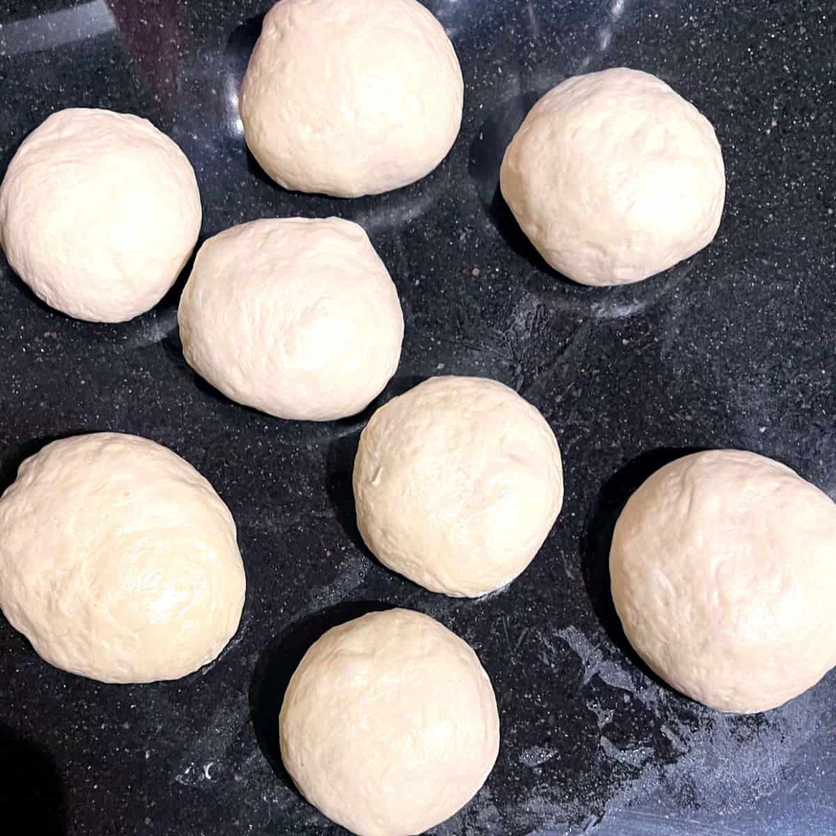 Balls of vegan naan dough.