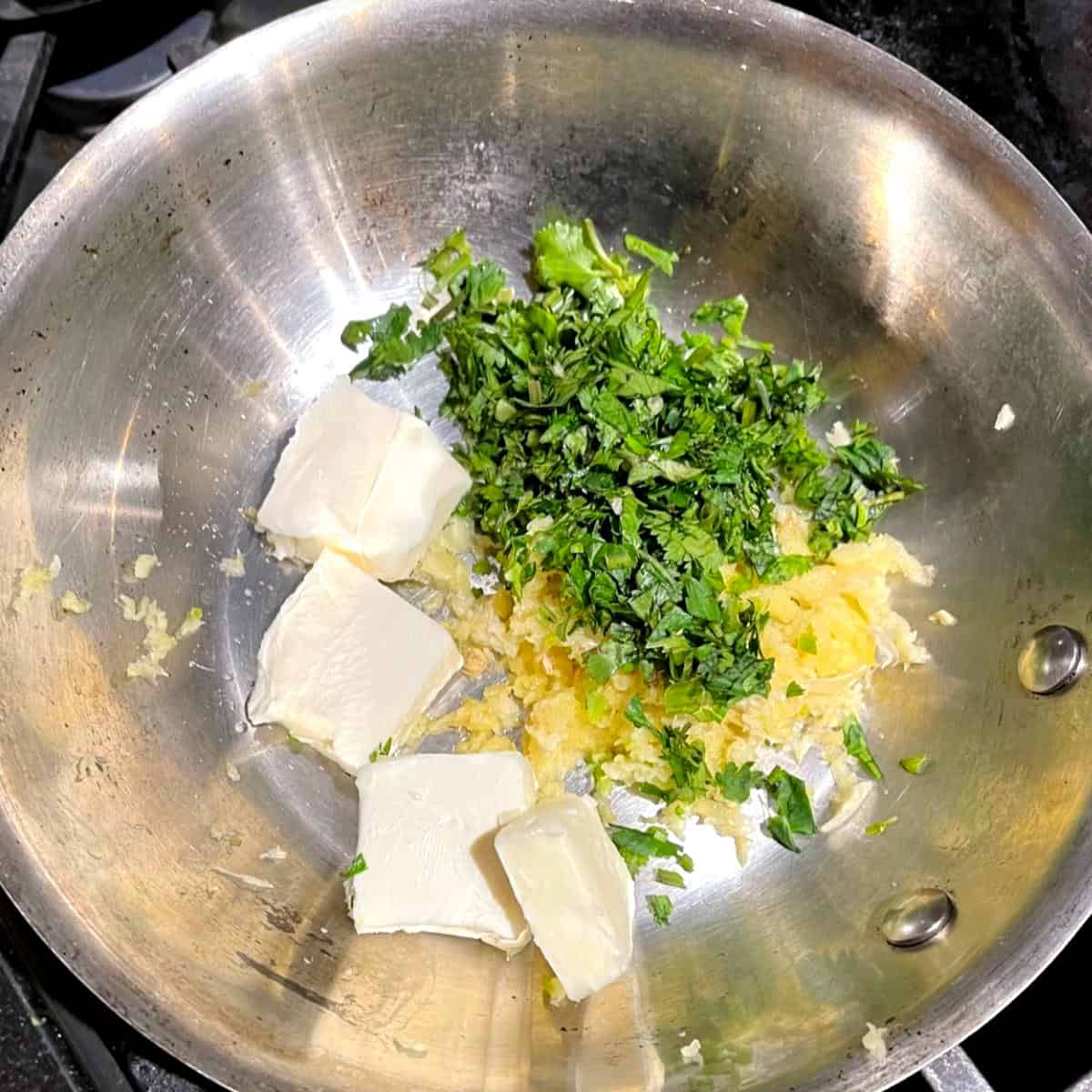 Ingredients for vegan garlic butter in skillet.