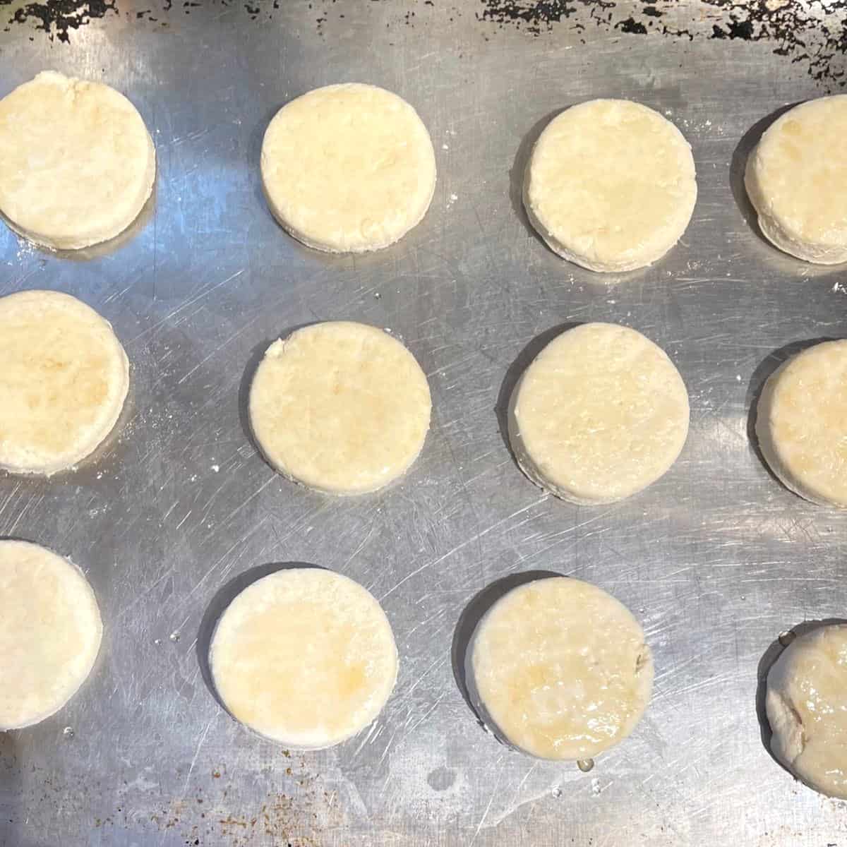 Vegan biscuits on baking sheet.