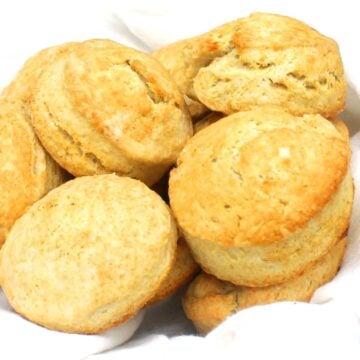 Vegan biscuits nestling in white kitchen towel.