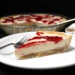 vegan white chocolate silk pie with raspberry drizzle and shortbread crust, glutenfree