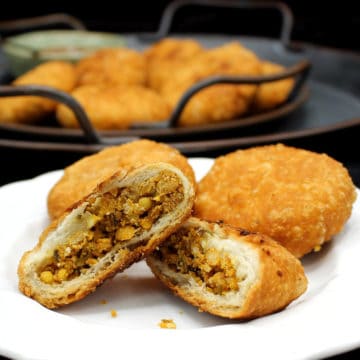 Kachori is a beloved savory Indian food, often sold on the streets. It has a crispy, flaky jacket of wheat wrapping a savory, spicy filling of moong dal. This homemade version make the perfect snack for a cold evening with a cup of hot tea. A vegan, soy-free and nut-free recipe.
