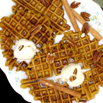 These tasty Vegan Sourdough Pumpkin Spice Waffles are infused with the seasonal flavor of pumpkin and the warmth of pumpkin pie spices like cinnamon, cloves and nutmeg. A wholegrain, soy-free and nut-free recipe, can be made with sourdough discard. #vegan, #pumpkinspice, #waffles, #sourdough | HolyCowVegan.net