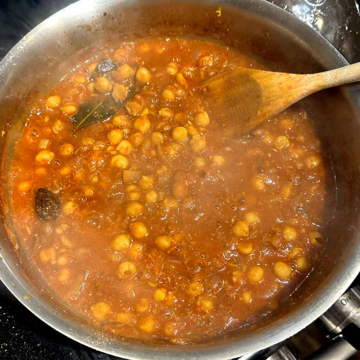 Photo of prepared chana masala in pot.