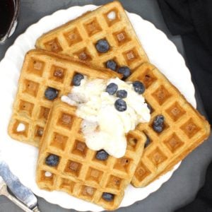 Vegan Waffles on a white plate with blueberries