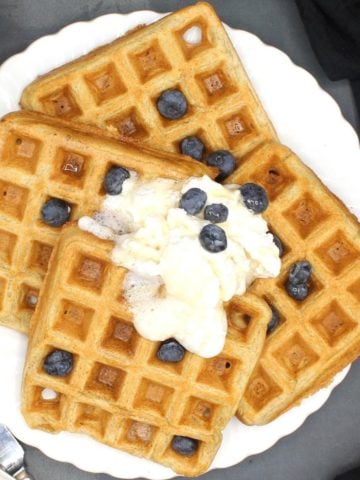Vegan Waffles on a white plate with blueberries
