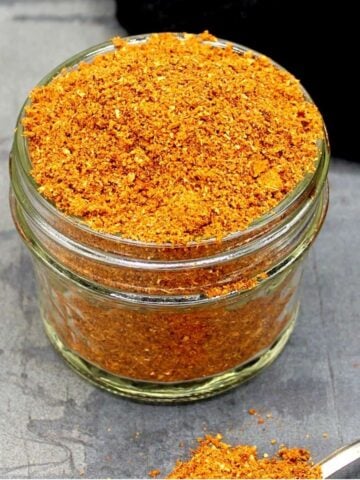 Front photo of a jar filled to the brim with garam masala