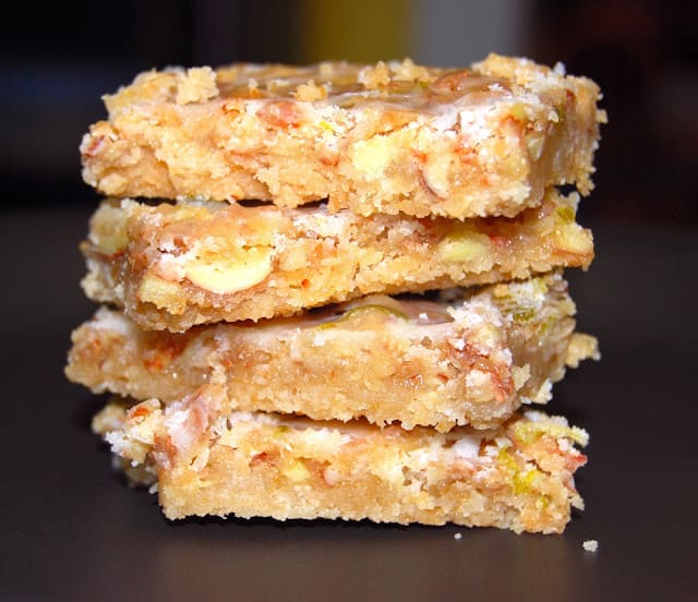 Photo of a stack of vegan almond bars with a citrus glaze.