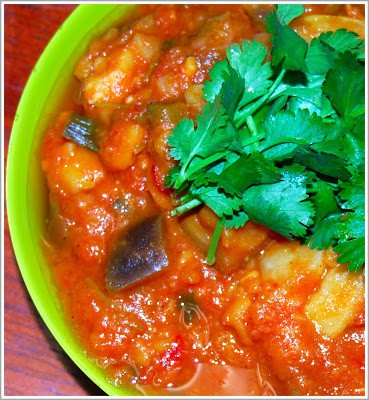 Photo of spicy fava bean eggplant stew with cilantro garnish.