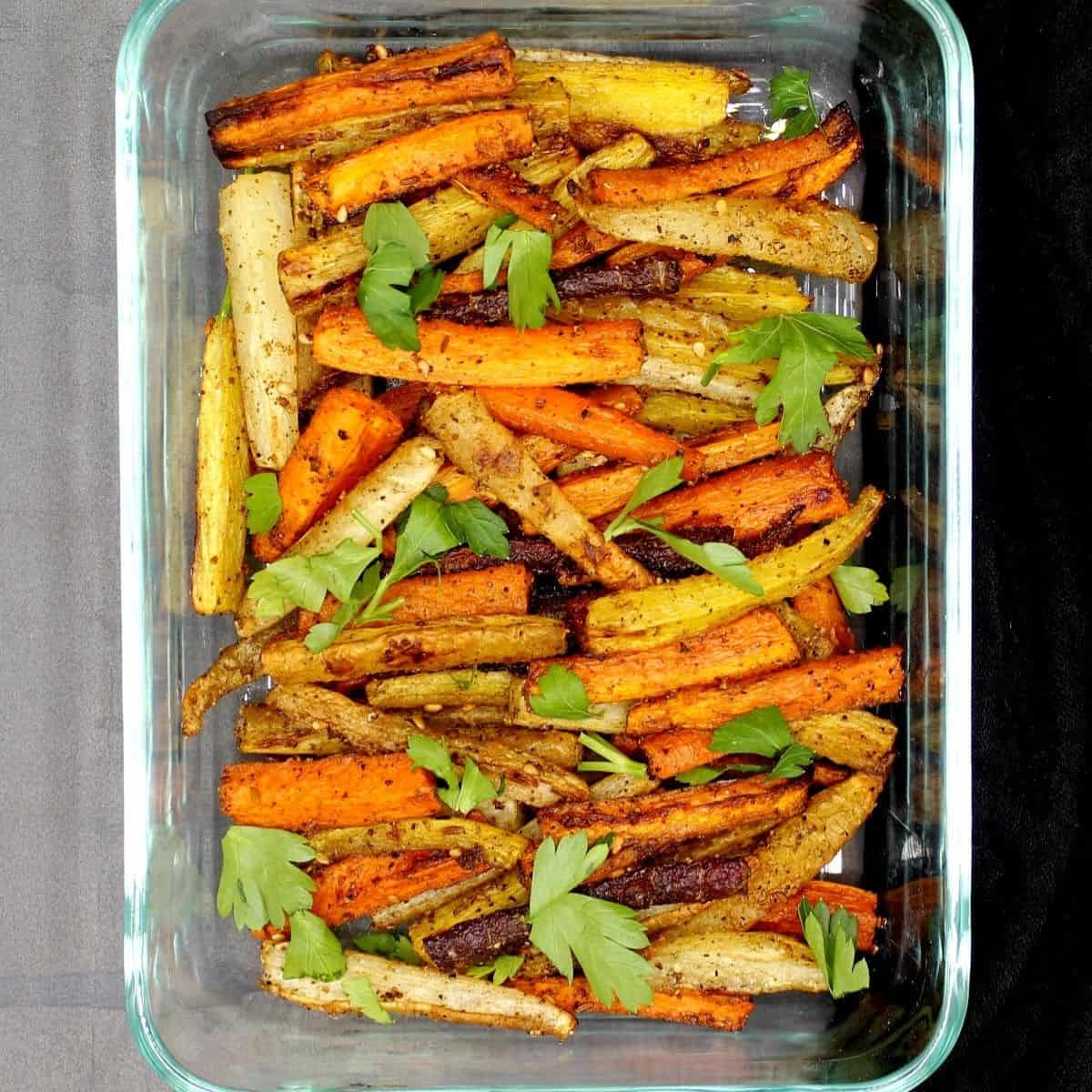 Roasted multicolored carrots in a baking dish