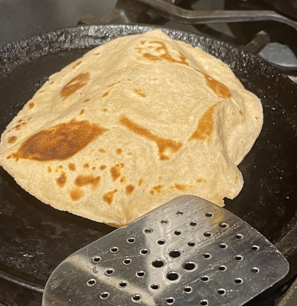 Photo of a sourdough roti baked on a griddle
