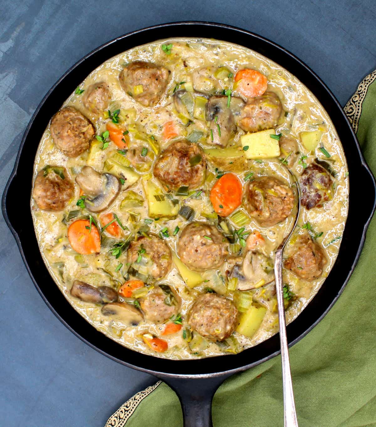 Overhead photo of vegan fricassee with meatballs and veggies.