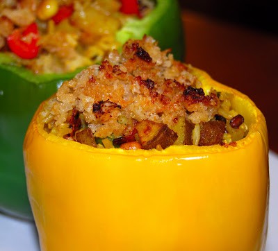 Close up of yellow pepper stuffed with savory brown rice filling.