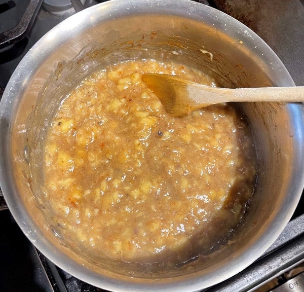 Banana jam cooking in saucepan.