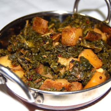 Kale Potato Sabzi in karahi bowl.
