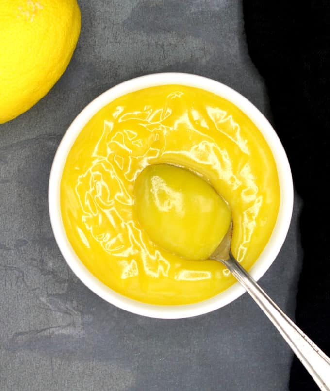 Vegan lemon curd with spoon.